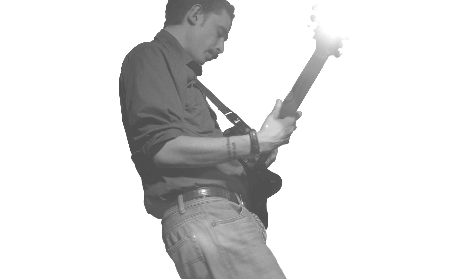 Sytlish black and white photo of musician/composer Marc Wencelius playing the electric guitar. Photo credited to Musicos Productions. Design by Musicos Productions
